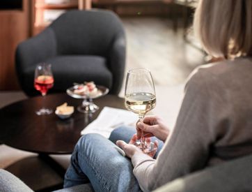 A woman is enjoying an aperitif